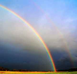 photography of rainbow during cloudy sky